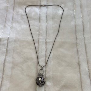 Sterling silver necklace and silver tone cage pendant